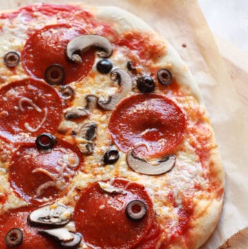 Sourdough pizza with pepperoni and mushrooms